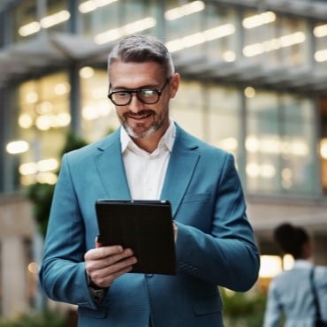 Businessman on tablet device